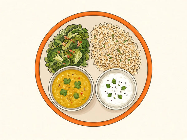 A top-down plate with greens, rice, a bowl of dal and a bowl of curd.