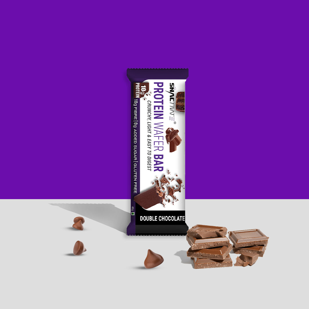 Single Double Chocolate Protein Wafer Bar standing upright next to chocolate chunks