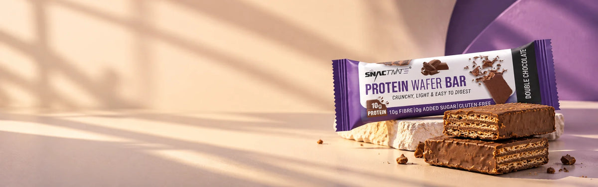 Snactivate Double Chocolate protein wafer bar and wafer pieces in warm afternoon light
